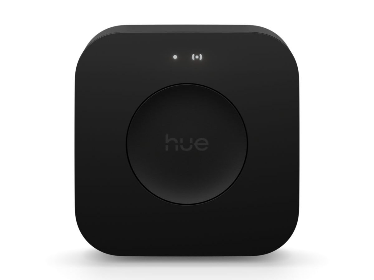 Hue Bridge Pro, ponte preta quadrada da Philips Hue com logo hue no botão central, vista de frente